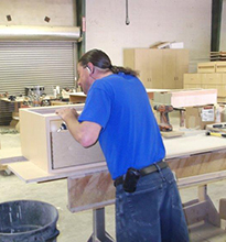 Brady assembling a cabinet